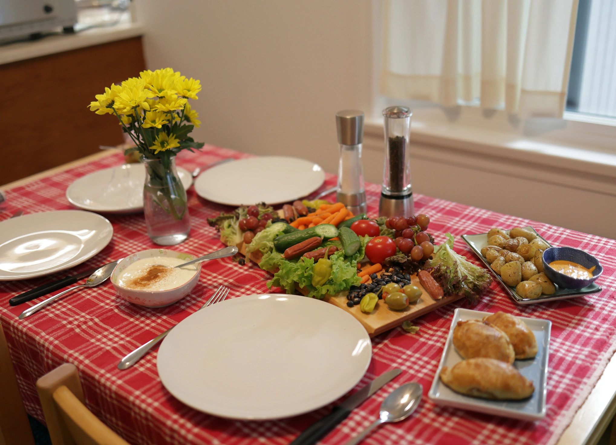 Charcuterie-style family dinner spread on a table